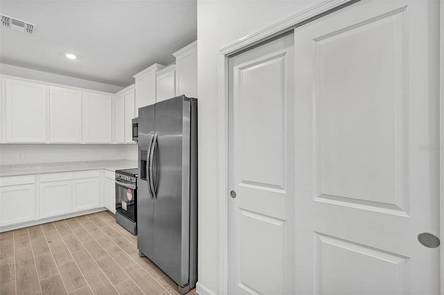 Furnished interior view inside a new home in , Dunnellon (Image 8).