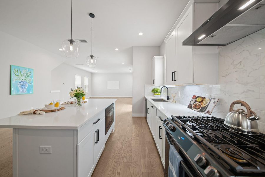 Paired with under-mount lighting to brighten the workspace, the cabinets are complemented by a stylish back splash that completes the kitchen’s polished look. Paired with under-mount lighting to brighten the workspace, the cabinets are complemented by a stylish back splash that completes the kitchen’s polished look.