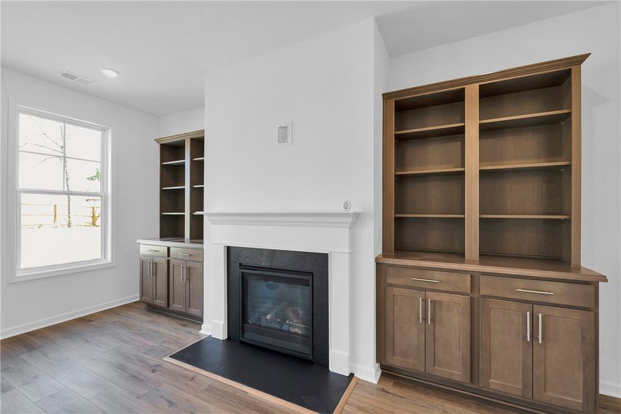 This living area features rich hardwood floors, a