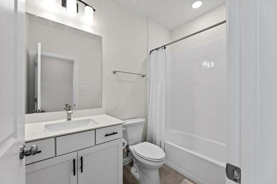The hall bathroom is convenient and clean! It's located near the front of the home and between the 2 secondary bedrooms. The hall bathroom is convenient and clean! It's located near the front of the home and between the 2 secondary bedrooms.