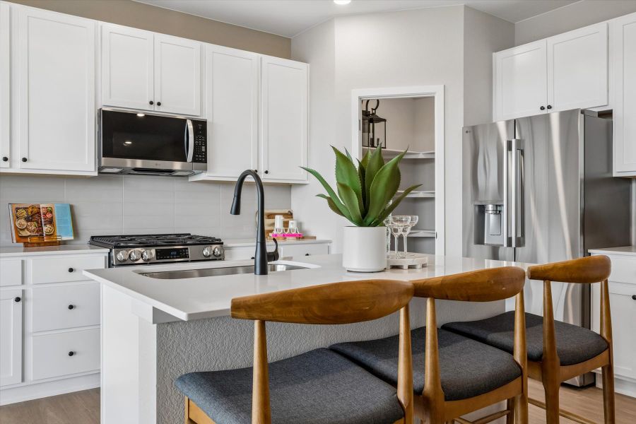 A kitchen with white cabinets. A kitchen with white cabinets.