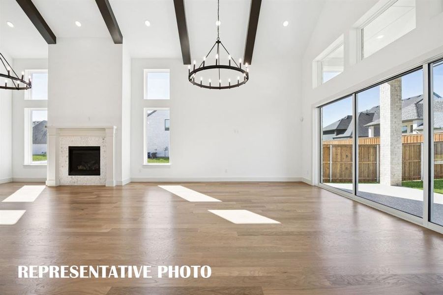 A wall of windows floods this spacious family room with natural light.  REPRESENTATIVE PHOTO