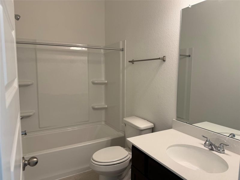 Furnished interior view inside a new home in East Gate Villas, Willis (Image 6).