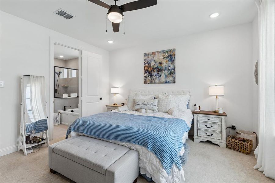 Generous proportions provide ample space for a king-sized furniture arrangement while maintaining an open, airy feel throughout the room.