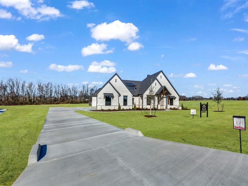 Front exterior of a new home in , Weatherford, TX, highlighting curb appeal (Image 26). Front exterior of a new home in , Weatherford, TX, highlighting curb appeal (Image 26).