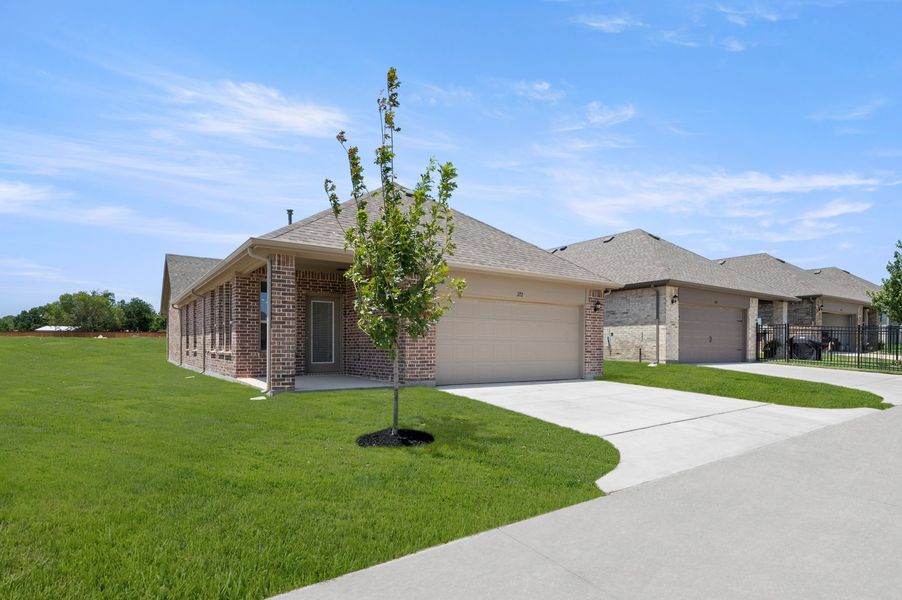 Front exterior of a new home in Redden Farms – Active Adult, Midlothian, TX, highlighting curb appeal (Image 27). Front exterior of a new home in Redden Farms – Active Adult, Midlothian, TX, highlighting curb appeal (Image 27).