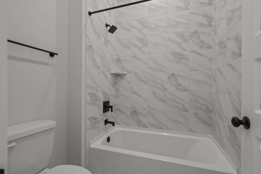 A shower with a glass wall. A shower with a glass wall.