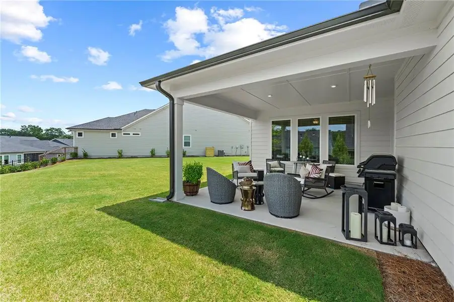 Exterior details and patio area of a home in Crescent Pointe at Great Sky, Canton (Image 22).