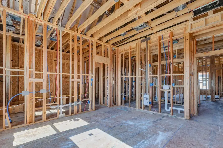 Construction progress view showing future bathroom and adjoining room framing, including plumbing rough-ins, electrical lines, and mechanical components. This image gives buyers a behind-the-scenes look at the home’s infrastructure and how the private living areas are being carefully planned and connected. Construction progress view showing future bathroom and adjoining room framing, including plumbing rough-ins, electrical lines, and mechanical components. This image gives buyers a behind-the-scenes look at the home’s infrastructure and how the private living areas are being carefully planned and connected.