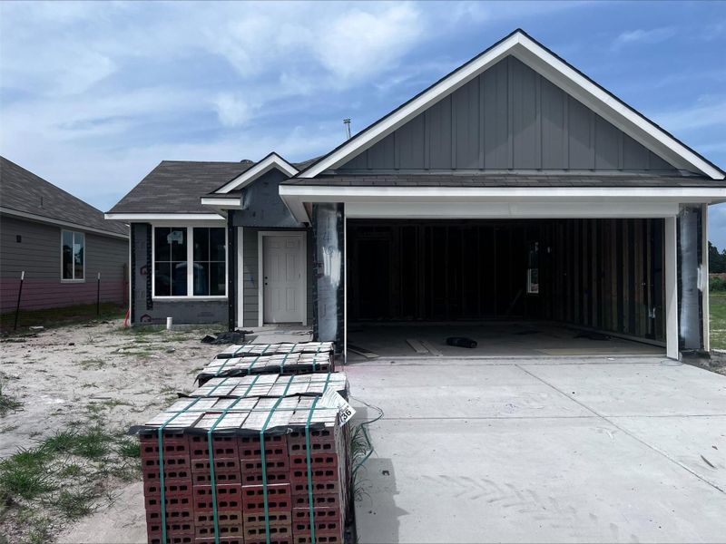 Front exterior of a new home in Sterling Ridge, Huntsville, TX, highlighting curb appeal (Image 1). Front exterior of a new home in Sterling Ridge, Huntsville, TX, highlighting curb appeal (Image 1).