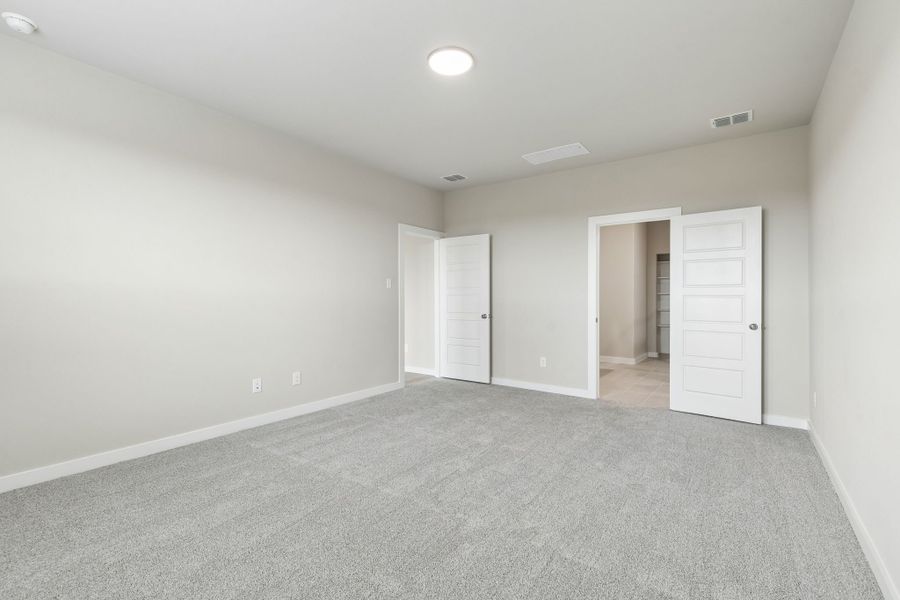 Primary Suite in the Winters home plan by Trophy Signature Homes – REPRESENTATIVE PHOTO