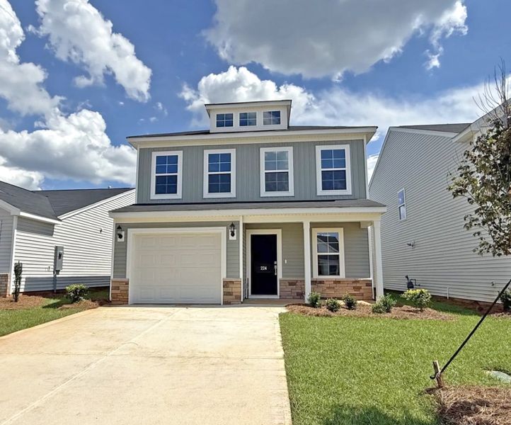 Front exterior of a new home in Laurinton Farms, Hopkins, SC, highlighting curb appeal (Image 1). Front exterior of a new home in Laurinton Farms, Hopkins, SC, highlighting curb appeal (Image 1).