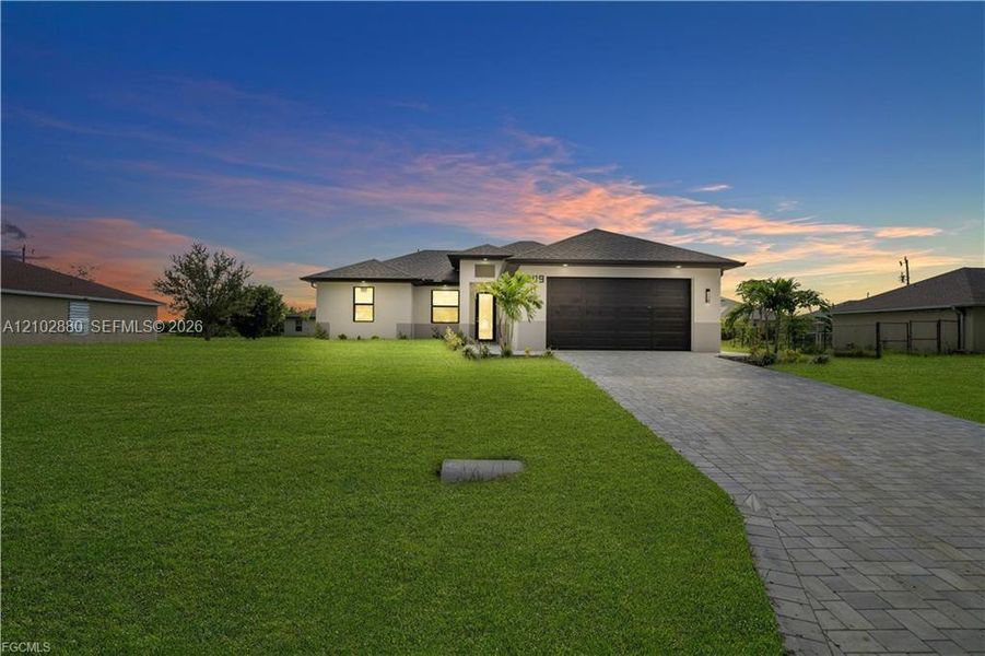 Front exterior of a new home in , Cape Coral, FL, highlighting curb appeal (Image 20). Front exterior of a new home in , Cape Coral, FL, highlighting curb appeal (Image 20).