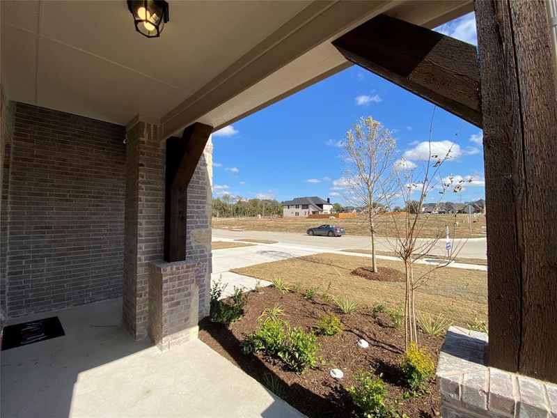 Friendly Southern-style covered front porch to sit and watch the world go by
