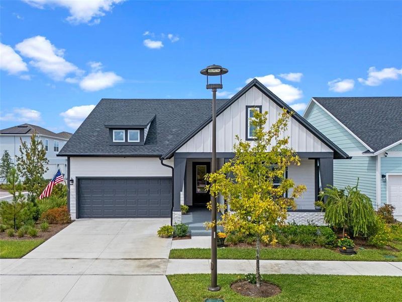Front exterior of a new home in , St. Cloud, FL, highlighting curb appeal (Image 21).