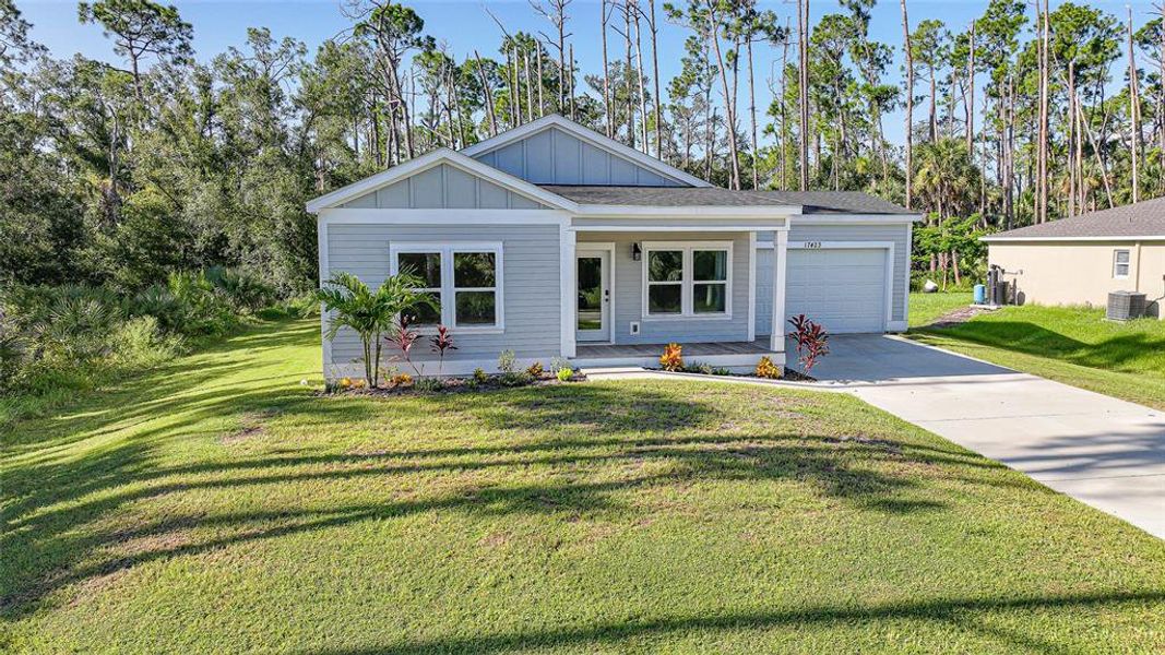 Front exterior of a new home in , Port Charlotte, FL, highlighting curb appeal (Image 1).