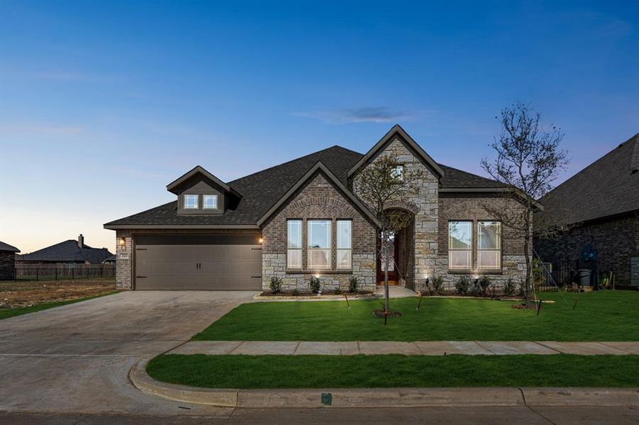 Front exterior of a new home in Abe's Landing, Granbury, TX, highlighting curb appeal (Image 21). Front exterior of a new home in Abe's Landing, Granbury, TX, highlighting curb appeal (Image 21).