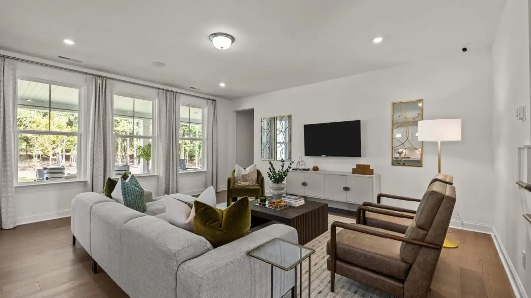 Spacious and bright family room with elevated ceiling and large windows, in the Townsend Design by DRB Homes in York, SC Spacious and bright family room with elevated ceiling and large windows, in the Townsend Design by DRB Homes in York, SC