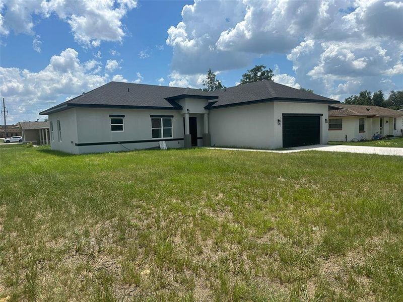Front exterior of a new home in , Ocala, FL, highlighting curb appeal (Image 11).