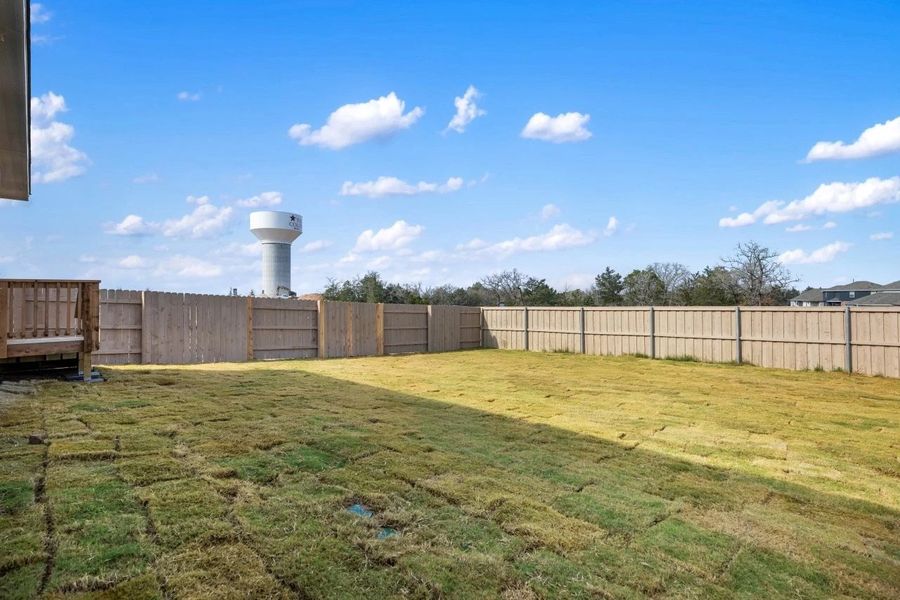 Exterior details and patio area of a home in The Colony, Bastrop (Image 27).