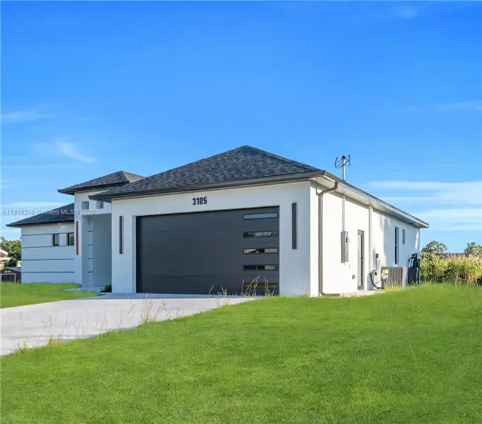 Front exterior of a new home in , Lehigh Acres, FL, highlighting curb appeal (Image 1). Front exterior of a new home in , Lehigh Acres, FL, highlighting curb appeal (Image 1).