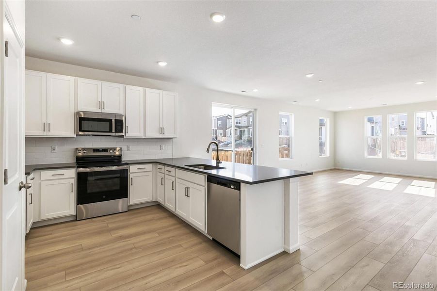 Furnished interior view inside a new home in Turnberry, Commerce City (Image 6).