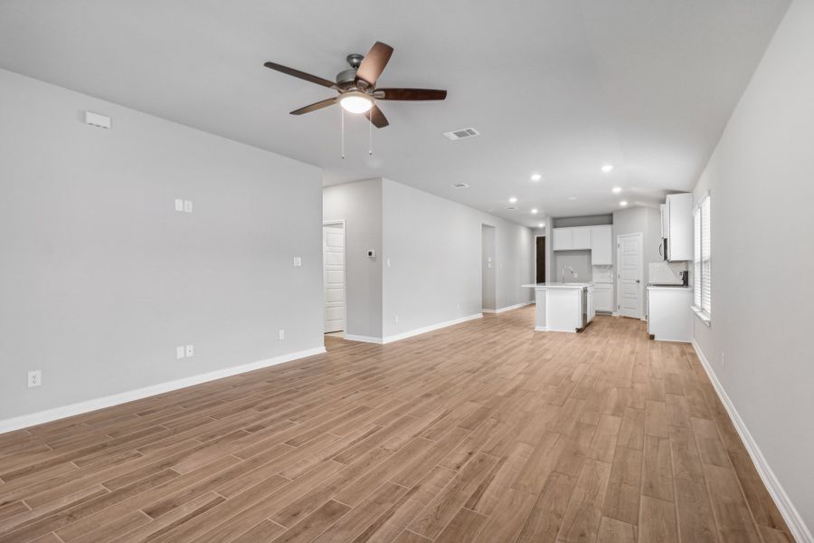 Dining room and living room in the Allen floorplan at a Meritage Homes community. Dining room and living room in the Allen floorplan at a Meritage Homes community.