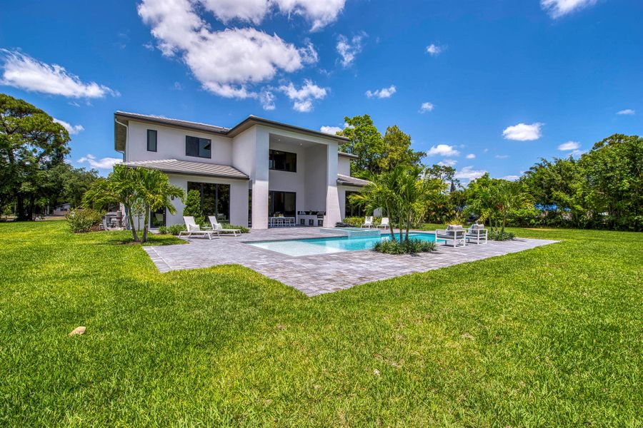 Front exterior of a new home in , Palm Beach Gardens, FL, highlighting curb appeal (Image 21).