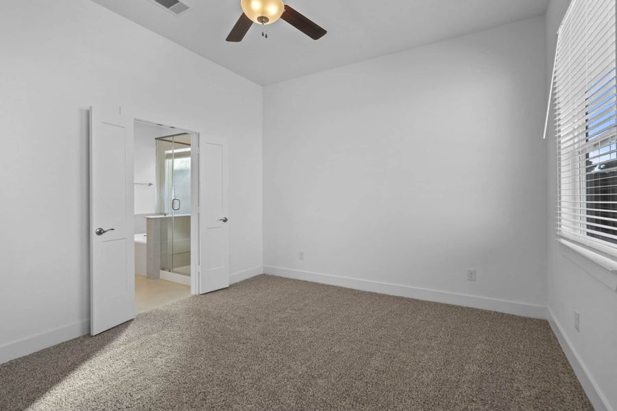 Representative unfurnished interior of a home built from the Adele by Chesmar Homes in Sunterra, Katy (Image 11).