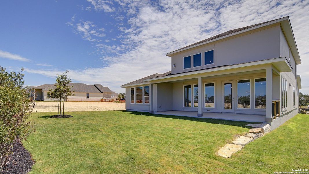 Front exterior of a new home in Esperanza 60', Boerne, TX, highlighting curb appeal (Image 19).