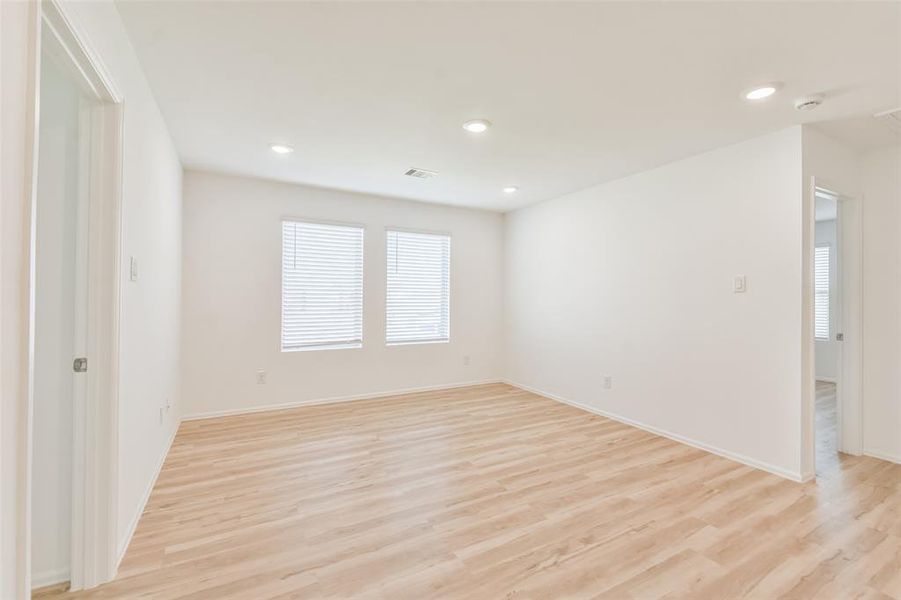 Large Game room with sliding door storage closet with enough space to store all your games and toys!