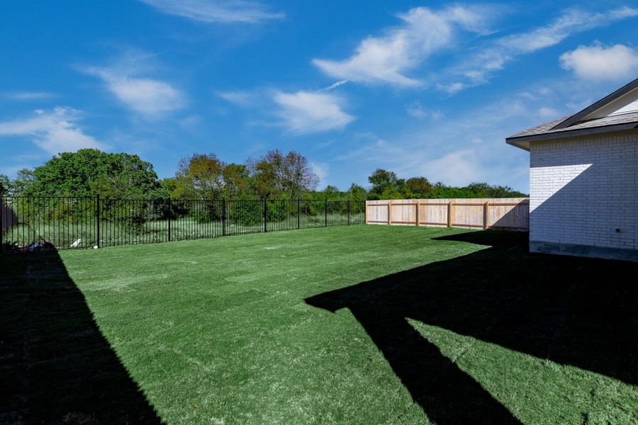Exterior details and patio area of a home in Santa Rita Ranch - 60', Liberty Hill (Image 21). Exterior details and patio area of a home in Santa Rita Ranch - 60', Liberty Hill (Image 21).