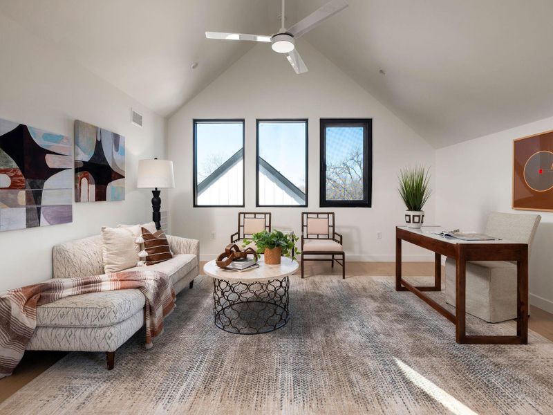 Living area with ceiling fan and beam ceiling