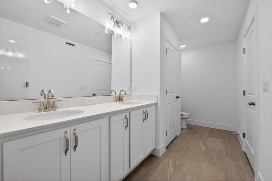 Furnished interior view inside a new home in Parkview at Hamlin, Winter Garden (Image 13).