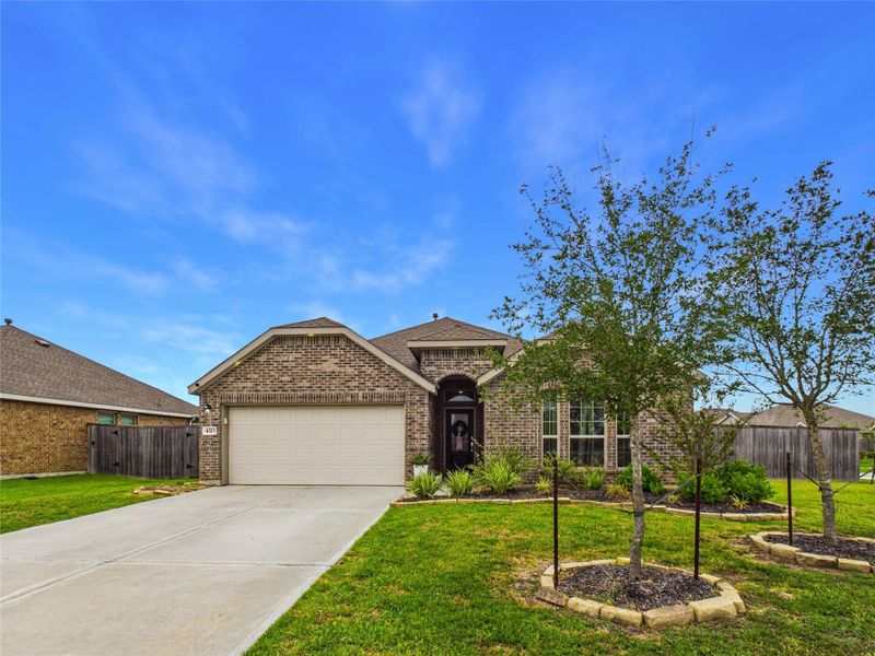 Front exterior of a new home in Sterling Point at Baytown Crossings: Wildflower II Collection, Baytown, TX, highlighting curb appeal (Image 1). Front exterior of a new home in Sterling Point at Baytown Crossings: Wildflower II Collection, Baytown, TX, highlighting curb appeal (Image 1).