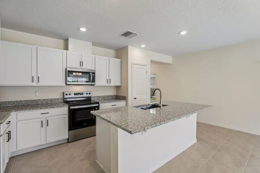 Furnished interior view inside a new home in Reserve at Forest Lake Townhomes, Lake Wales (Image 4).