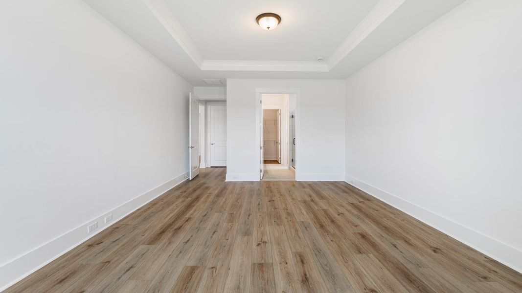 Spacious, unfurnished interior of a new home in Summerwind Crossing at Lakes of Cane Bay, Summerville (Image 11).