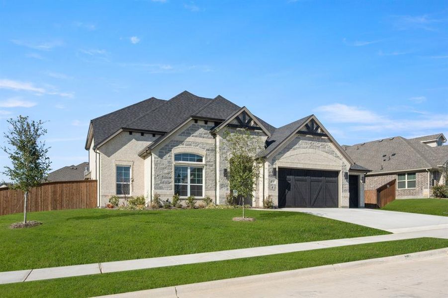Front exterior of a new home in Hayes Crossing - Phase 2, Midlothian, TX, highlighting curb appeal (Image 2).