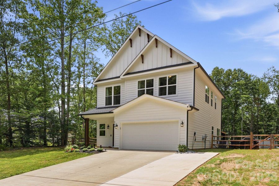Front exterior of a new home in , Troutman, NC, highlighting curb appeal (Image 23).