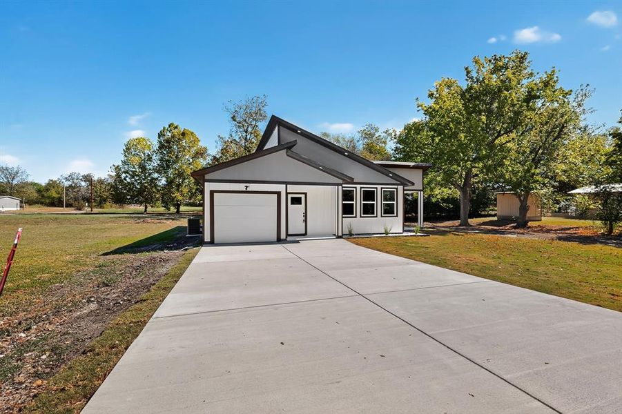 Front exterior of a new home in , Cooper, TX, highlighting curb appeal (Image 2). Front exterior of a new home in , Cooper, TX, highlighting curb appeal (Image 2).