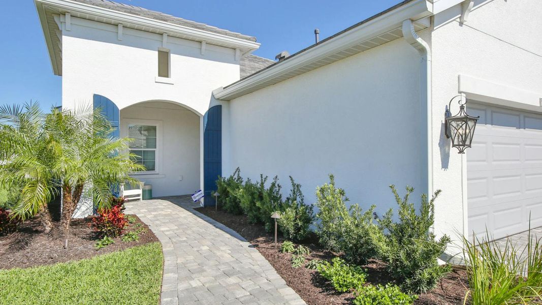 Exterior details and patio area of a home in Palm Grove Real Estate and Homes for Sale in Lakewood Ranch, FL - Neal Communities, Lakewood Ranch (Image 27).