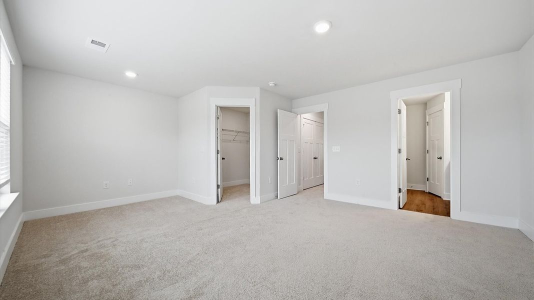 Primary suite that offers first-rate relaxation with established style and elevated finishes by DRB Homes Primary suite that offers first-rate relaxation with established style and elevated finishes by DRB Homes