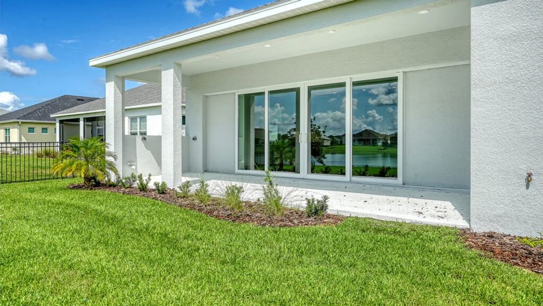 Exterior details and patio area of a home in Canoe Creek, Parrish (Image 19).