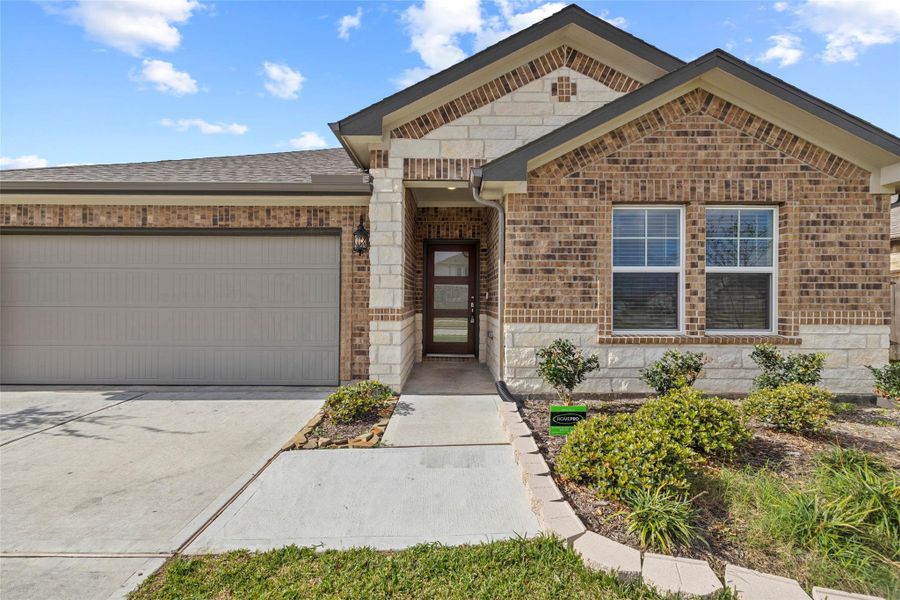 Front exterior of a new home in Wall Street Village, Richmond, TX, highlighting curb appeal (Image 23).