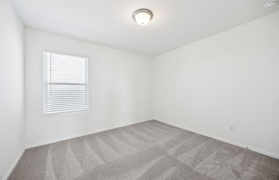 Comfortable bedroom with a bright window view Comfortable bedroom with a bright window view