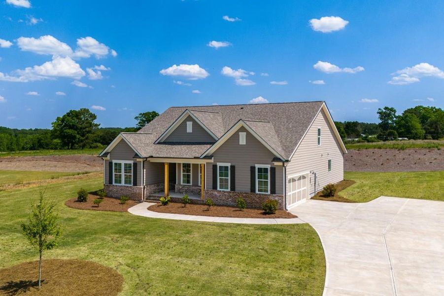 Front exterior of a new home in Magnolia Ridge, Monroe, GA, highlighting curb appeal (Image 22).