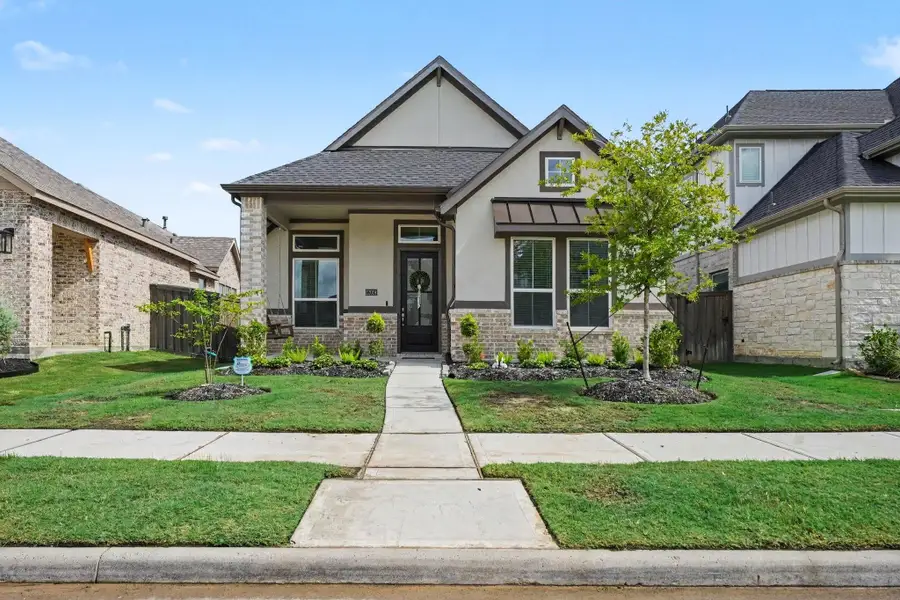 Front exterior of a new home in , Mont Belvieu, TX, highlighting curb appeal (Image 23).