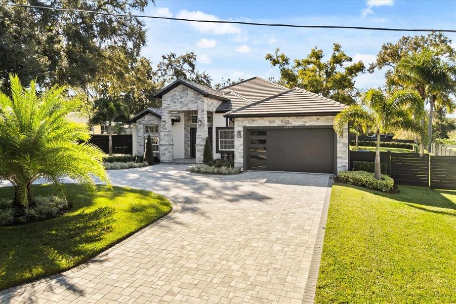 Front exterior of a new home in , Clermont, FL, highlighting curb appeal (Image 34). Front exterior of a new home in , Clermont, FL, highlighting curb appeal (Image 34).