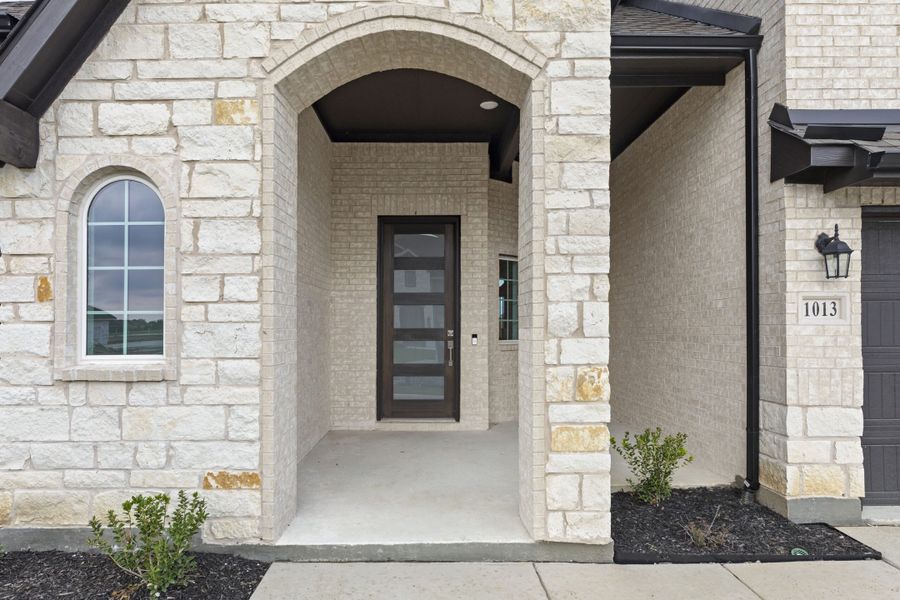 Exterior details and patio area of a home in Timberbrook, Justin (Image 3). Exterior details and patio area of a home in Timberbrook, Justin (Image 3).