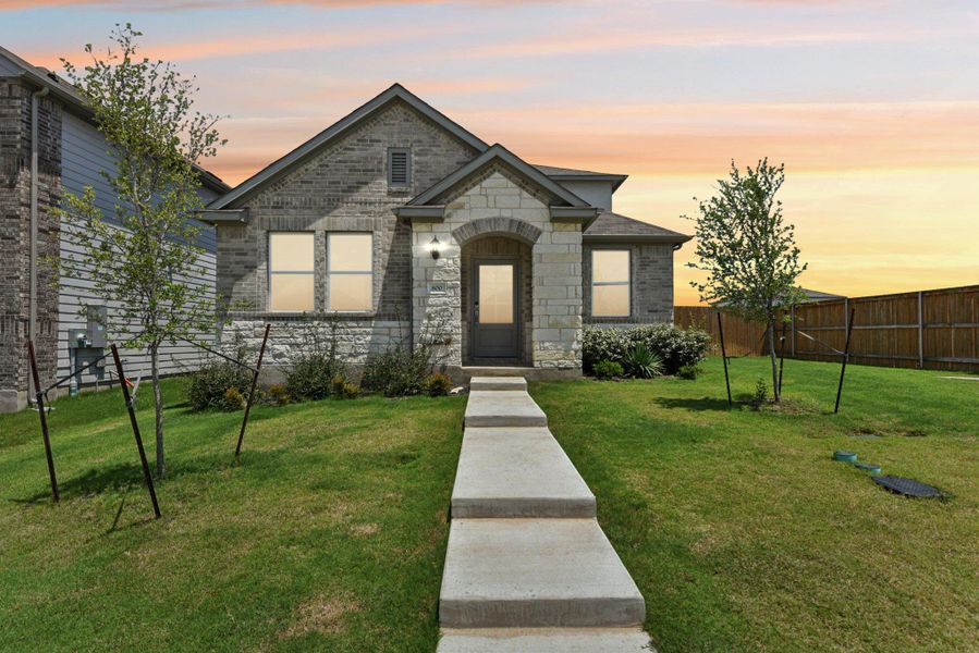 Front exterior of a new home in Stonewall Ranch, Liberty Hill, TX, highlighting curb appeal (Image 24).